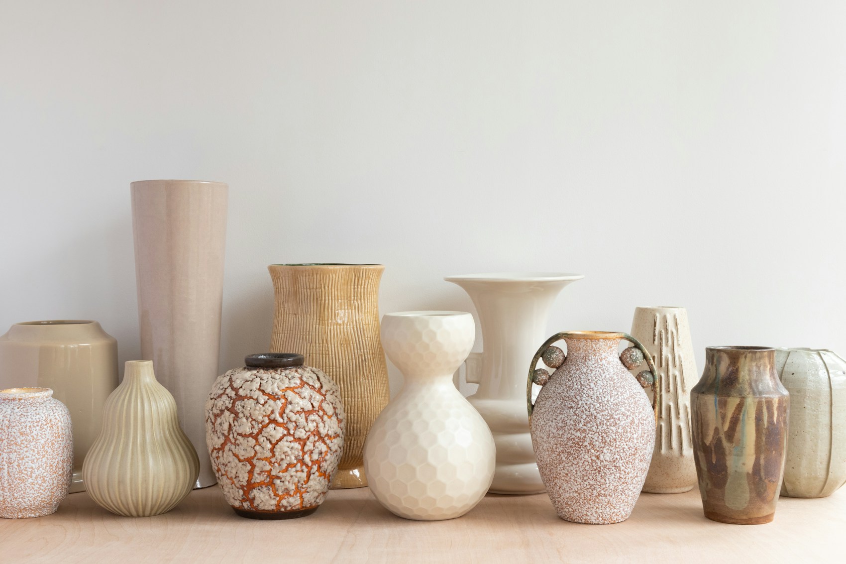A collection of ceramic vessels in natural glazes